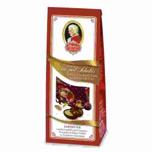 Mozart Schokis Zartbitter  100g, Doppelt gefüllt mit Sahne-Trüffel und Pistazien-Marzipan,, überzogen mit feinherber Zartbitter-Schokolade,, Reber